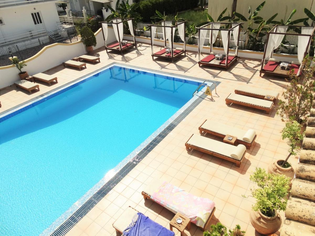 Oasis Beach Club Kavos Bagian luar foto